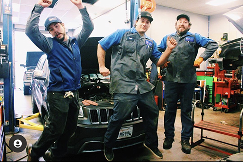 Staff Jumping ready to work! | Quality Automotive Servicing
